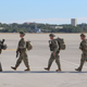 Paratroopers from the 82nd Airborne Division prepare to board transports bound for the Middle East, 2020.